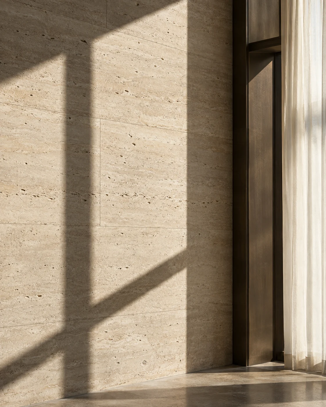 Soft daylight and precise shadows across limestone and bronze architectural details